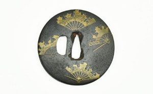 IRON TSUBA, ROUND SHAPE WITH BRASS INLAY OF BROKEN WAR